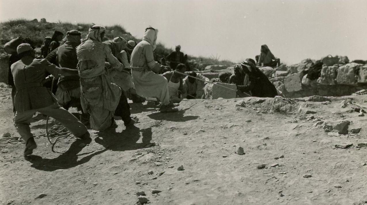 A Nabataean temple was discovered at the Dibon site in 1952. Here, workers remove part of a wall.